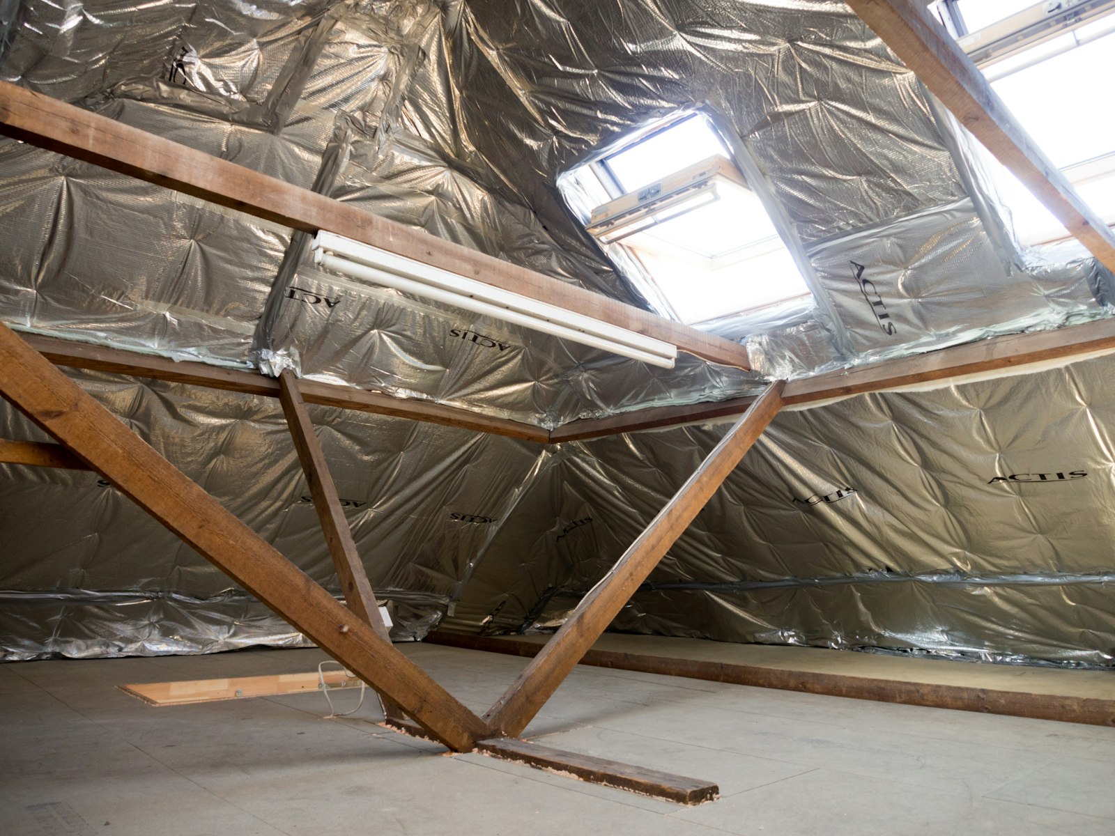 Residential attic space with reflective insulation installed